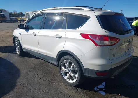 2014 Ford Escape Titanium z USA, uszkodzony, nr VIN 1FMCU0J9XEUC15671